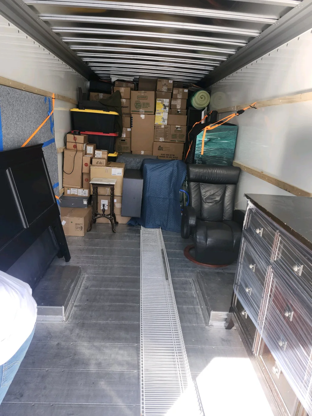 Household furniture and boxes inside a rental truck from a Rowann Tree Helping Hands job